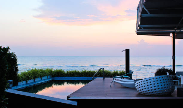 istock The seat at swimming pool with sea view before sunrise 1162466247
