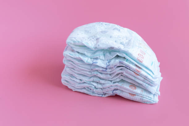 istock Some baby diapers on a Pink Background 1162467168