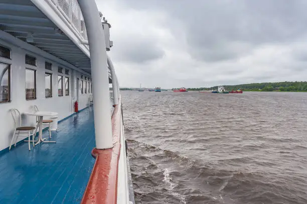 Empty deck of the ship in rainy weather in summer