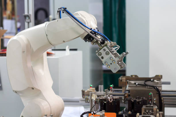 Factory 4.0 concept: View of gripper unit on handerling robot arm of automation machine.
