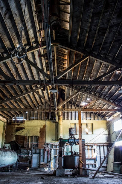 istock Old Industrial Building with Rusted Machinery Interior 1162470793