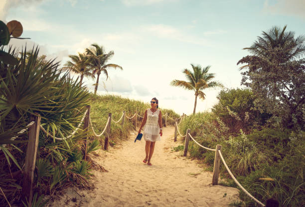 istock Woman on a footpath in Miami Beach 1162472007