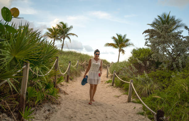istock Woman on a footpath in Miami Beach 1162472026