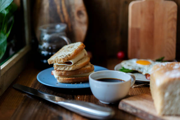 homemade healthy breakfast: Emmental cheese bacon sandwich, fried egg and asparagus