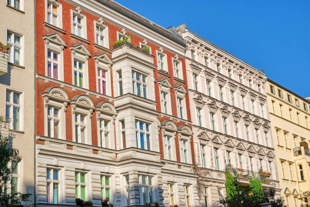 Front view of some renovated old apartment buildings Front view of some renovated old apartment buildings seen in Berlin, Germany old building stock pictures, royalty-free photos & images