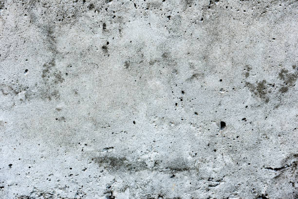 istock Texture of a concrete wall with cracks and scratches which can be used as a background 1162476205