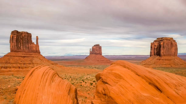 istock the mittens with foreground boulders in monument valley 1162476374
