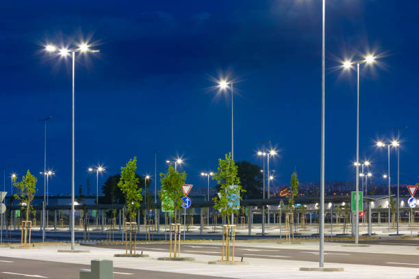 istock big modern empty parking area with LED street lights at evening 1162476943