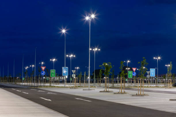 istock big modern empty parking area with LED street lights at evening 1162477904