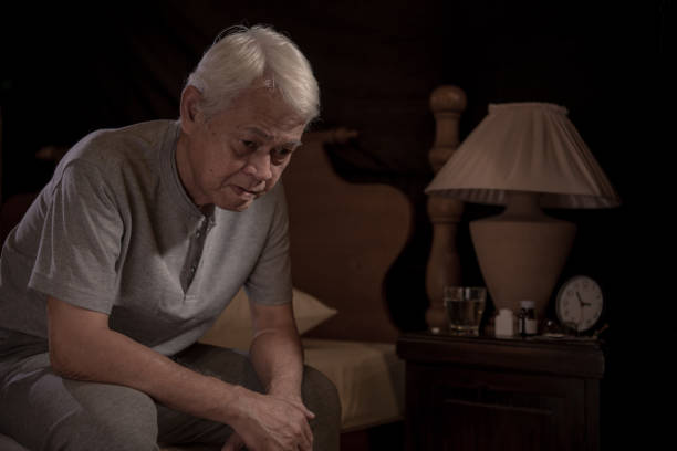 istock A depressed senior person sitting in bed cannot sleep from insomnia 1162477969