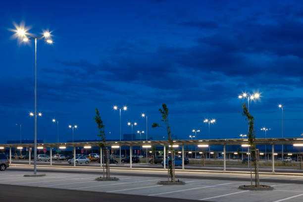 istock big modern empty parking area with LED street lights at night 1162478148