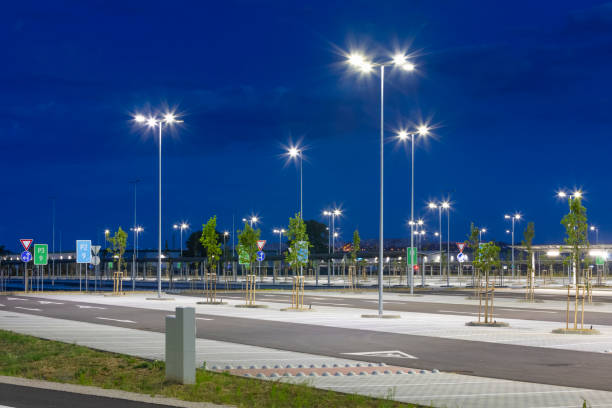 istock big modern empty parking area with LED street lights at evening 1162479035
