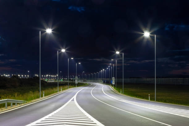 istock night empty road with modern LED street lights 1162481092