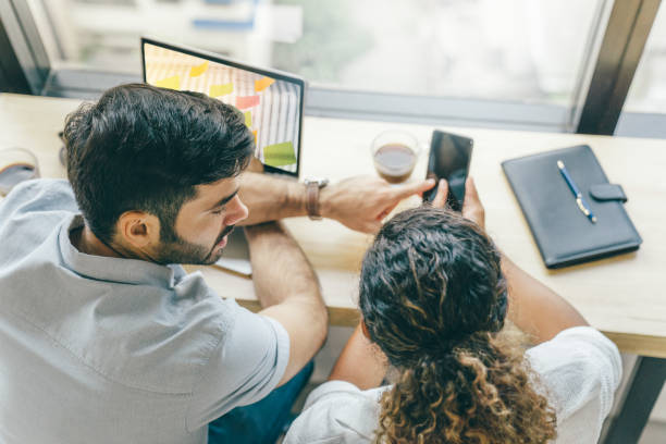 istock Young creative group meeting and looking at project planand discuss or brainstorm business strategy with post note. Workshop for startup team in modern office. 1162481177