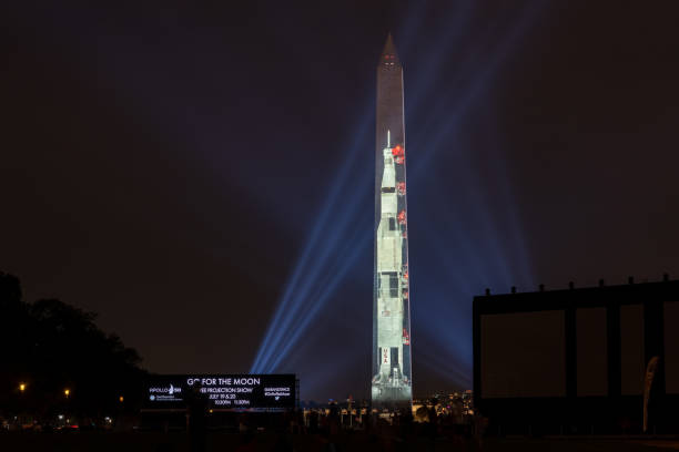 Apollo 50: Go for the Moon show projects a 363-foot Saturn V rocket on the east face of the Washington Monument Washington DC, July 16 2019: Apollo 50: Go for the Moon show projects a 363-foot Saturn V rocket on the east face of the Washington Monument. This is to celebrate the 50th anniversary of mans landing on the moon. apollo 11 stock pictures, royalty-free photos & images
