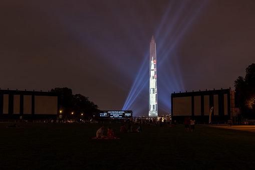 Washington DC, July 16 2019: Apollo 50: Go for the Moon show projects a 363-foot Saturn V rocket on the east face of the Washington Monument. This is to celebrate the 50th anniversary of mans landing on the moon.