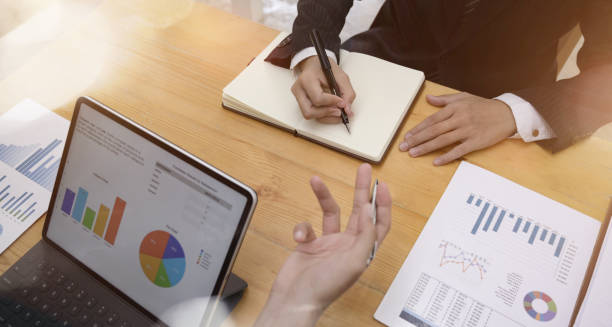 istock Business adviser analyzing financial figures denoting the progress in the 1162482202