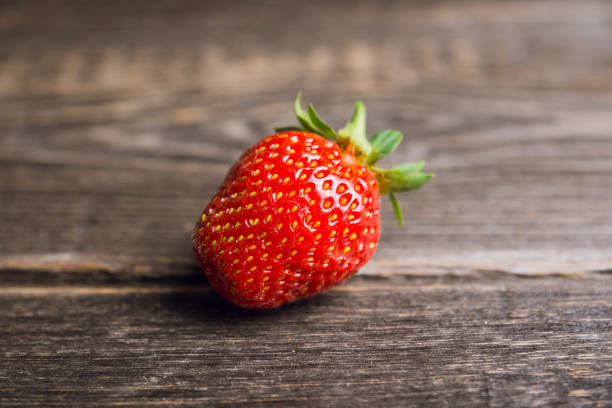 istock Ripe and juicy strawberries on the dark rustic background 1162483203