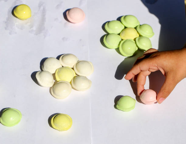istock children's hands are making multicolored small pelmeni for festive feast. 1162488763