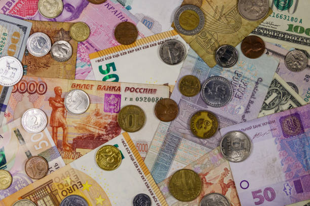 istock Background of banknotes and coins from different countries 1162489698
