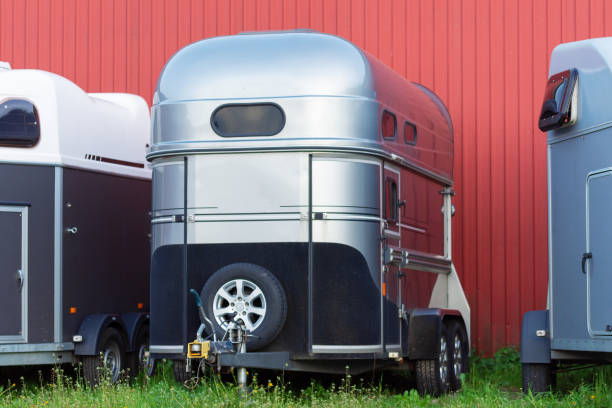 istock Several horse transportation trailers parked on the grass 1162493629