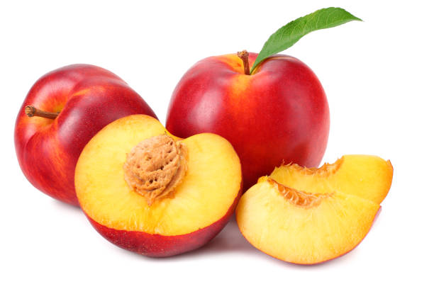 istock Nectarine with green leaf and slices isolated on white background 1162495281