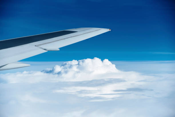 istock The sky seen from the plane. White and blue contrast. 1162495925