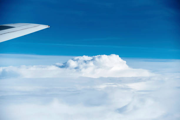 istock The sky seen from the plane. White and blue contrast. 1162496019