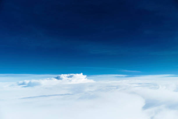 istock The sky seen from the plane. White and blue contrast. 1162496020