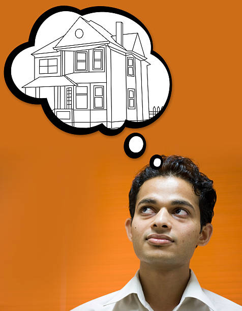Dream House Indian youth dreaming about his fantasy home vertical Indian youth dreaming about his fantasy home.  stars in your eyes stock pictures, royalty-free photos & images