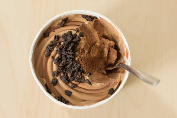 istock Chocolate and brownie ice cream on wooden table background. 1162499257