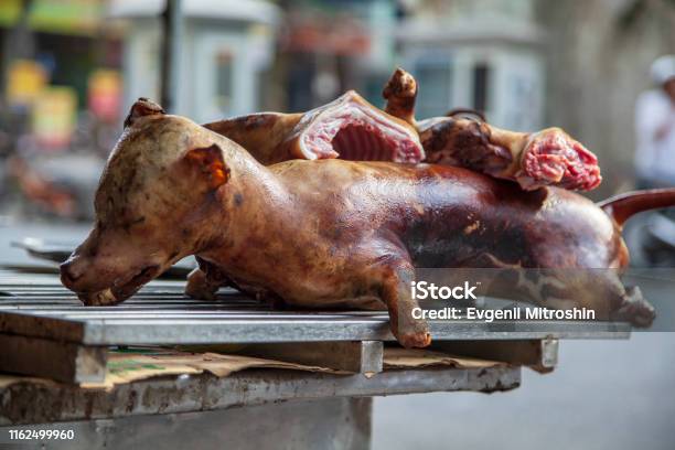 Dog Meat Sale In A Street Market In Vietnam Stock Photo - Download Image Now - Selling, Salesman, Dog Meat
