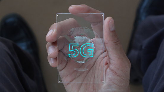 5G technology. Futuristic technology in hand. modern data hologram with application media in glass technology