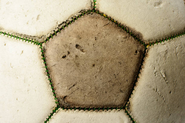 istock Used vintage soccer ball, close-up background with cracked texture 1162500270
