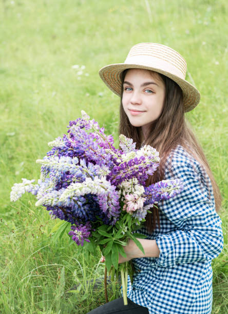 istock Girl in a summer field 1162500556