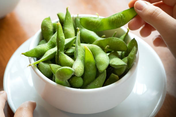 POV, Salted Edamame Beans, Eating Japanese Food by Hand stock photo