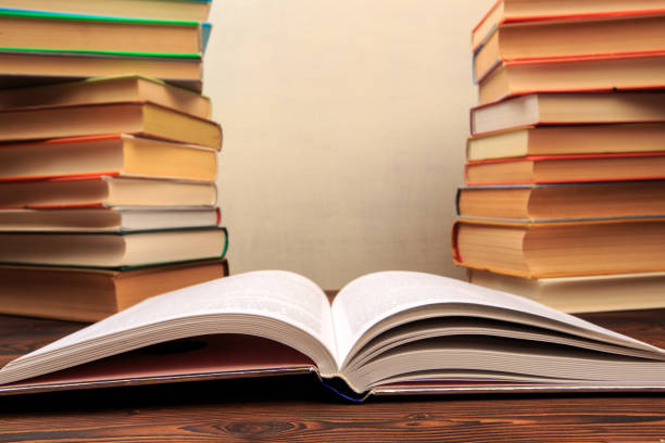 istock Education learning concept with opening book or textbook in old library, 1162503062