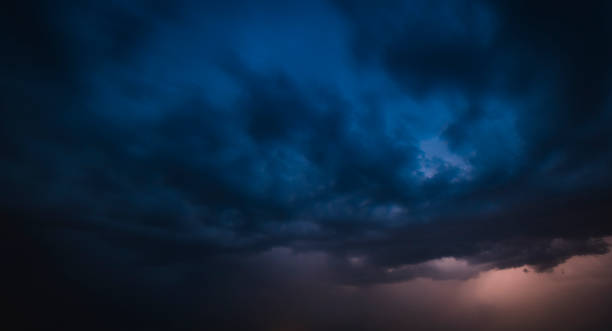 istock Lightning in the dark night sky over a lake during summer 1162505303