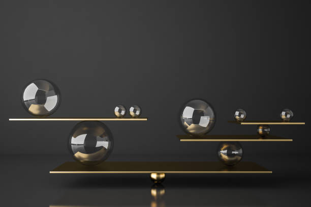 istock Gold balanced seesaw with spheres 1162507331