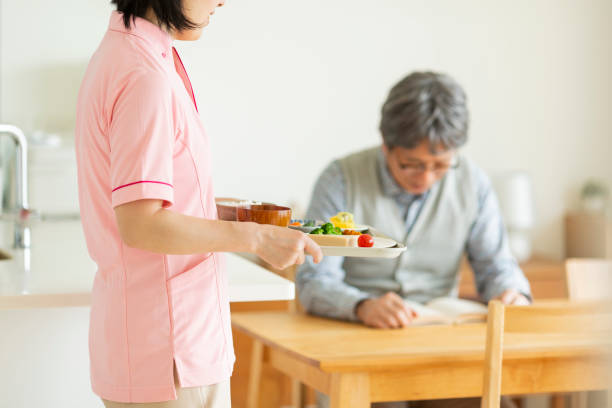 istock Caregiver preparing a meal 1162510405