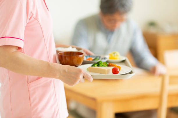 istock Caregiver preparing a meal 1162510409