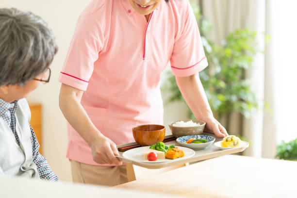 istock Caregiver preparing a meal 1162510445