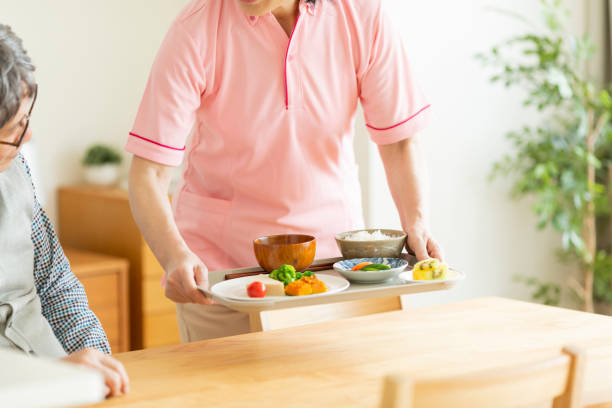istock Caregiver preparing a meal 1162510453
