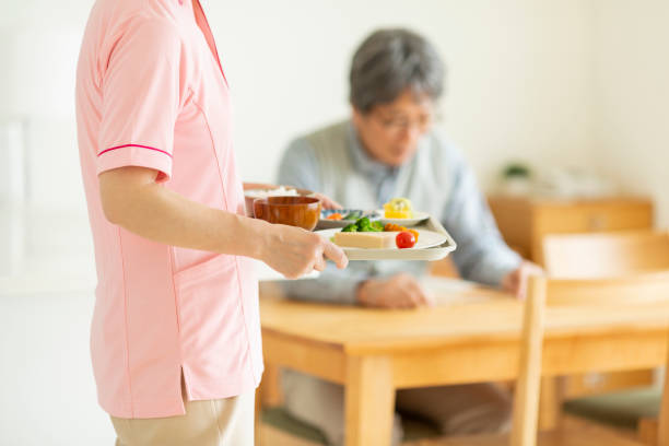istock Caregiver preparing a meal 1162510457