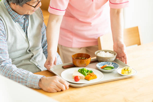 istock Caregiver preparing a meal 1162510459