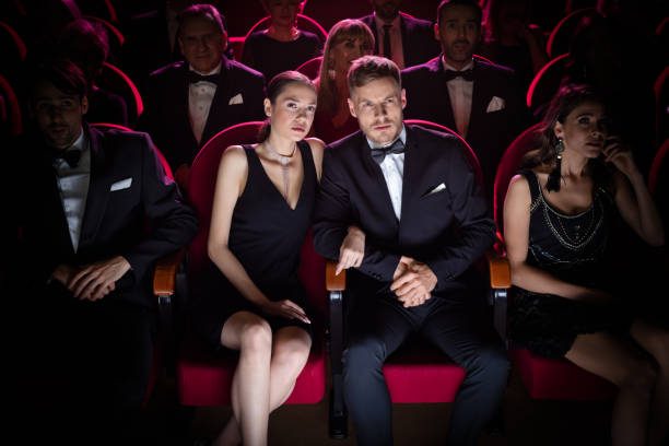 istock Serious couple watching opera in theater. 1162510482