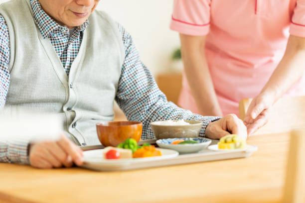 istock Caregiver preparing a meal 1162510523