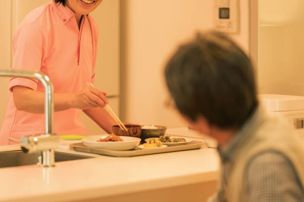 istock Caregiver preparing a meal 1162510527