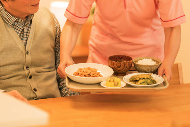 istock Caregiver preparing a meal 1162510544