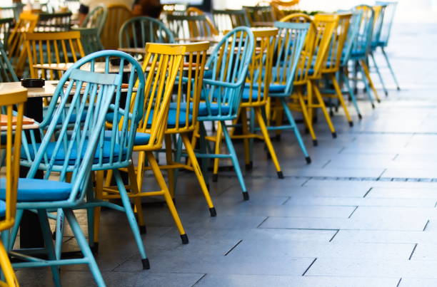 istock Yellow and Blue Chairs Outdoors on Street 1162511136